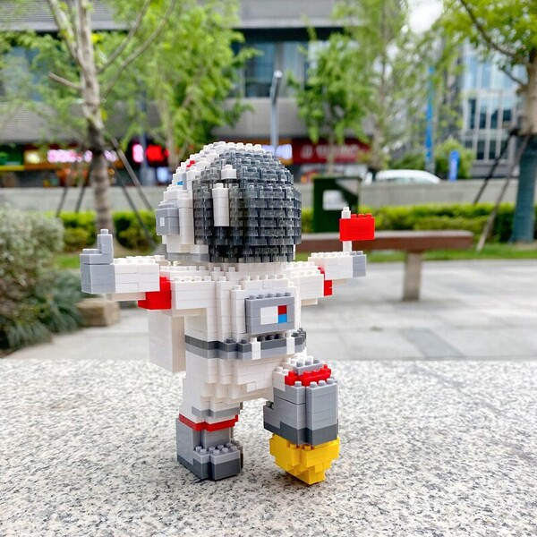 SC 8003-5 Standing Spaceman with LED Light Black Helmet and Red Flag
