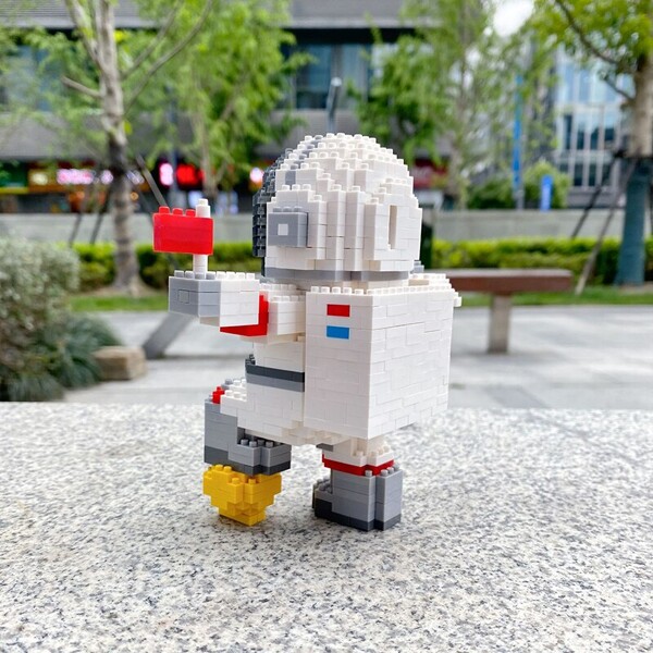 SC 8003-5 Standing Spaceman with LED Light Black Helmet and Red Flag