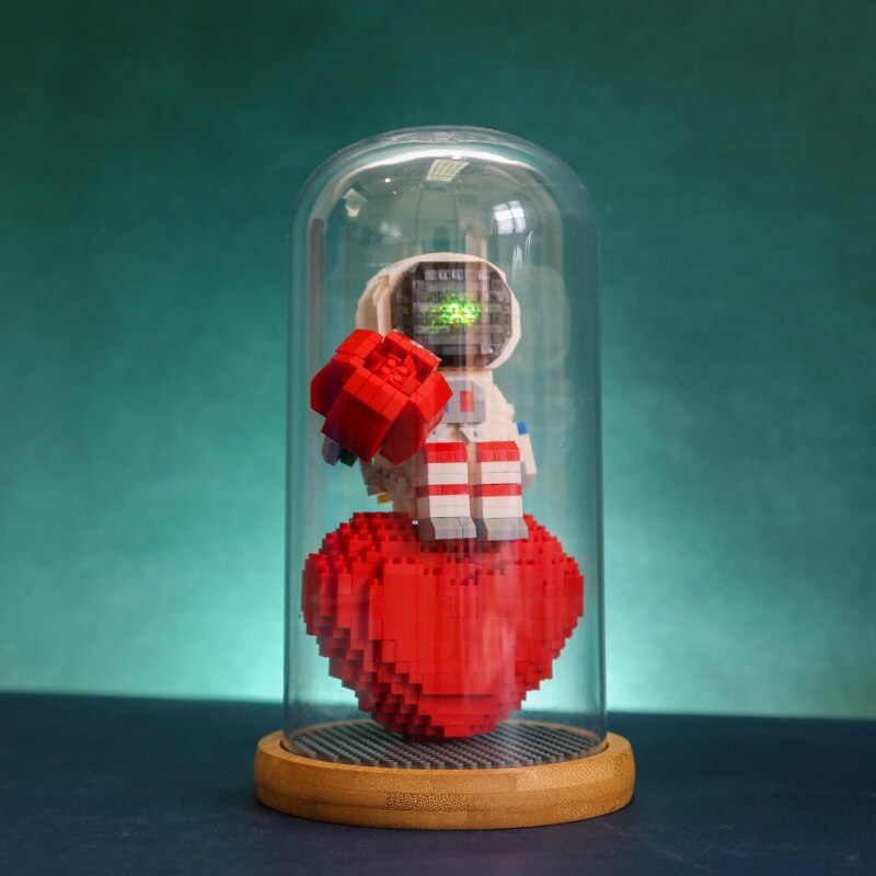 Wise Hawk 2701 Spaceman Sitting on Heart and Holding Rose with LED Light Display Covered Wood Base