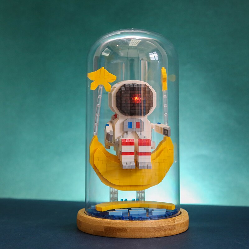 Wise Hawk 2702 Spaceman Sitting on Moon Star Water with LED Light Display Covered Wood Base