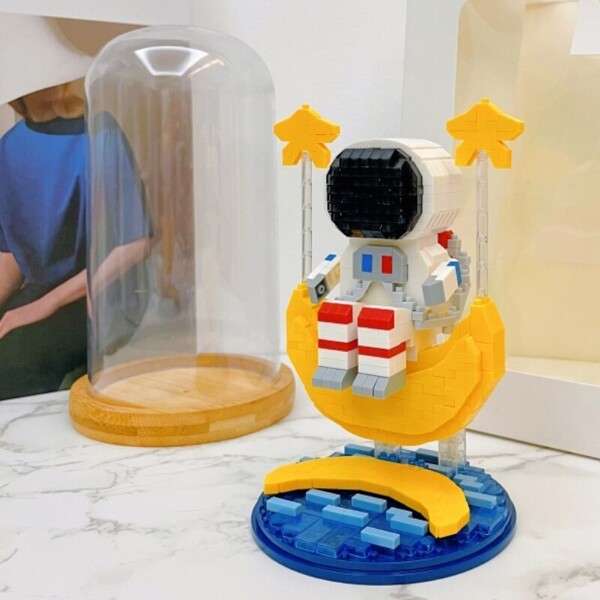 Wise Hawk 2702 Spaceman Sitting on Moon Star Water with LED Light Display Covered Wood Base